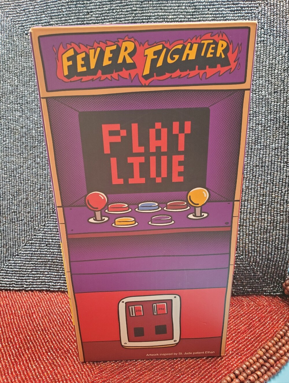 Limited-edition St. Jude "Fever Fighter" vinyl action figure. (C26)
